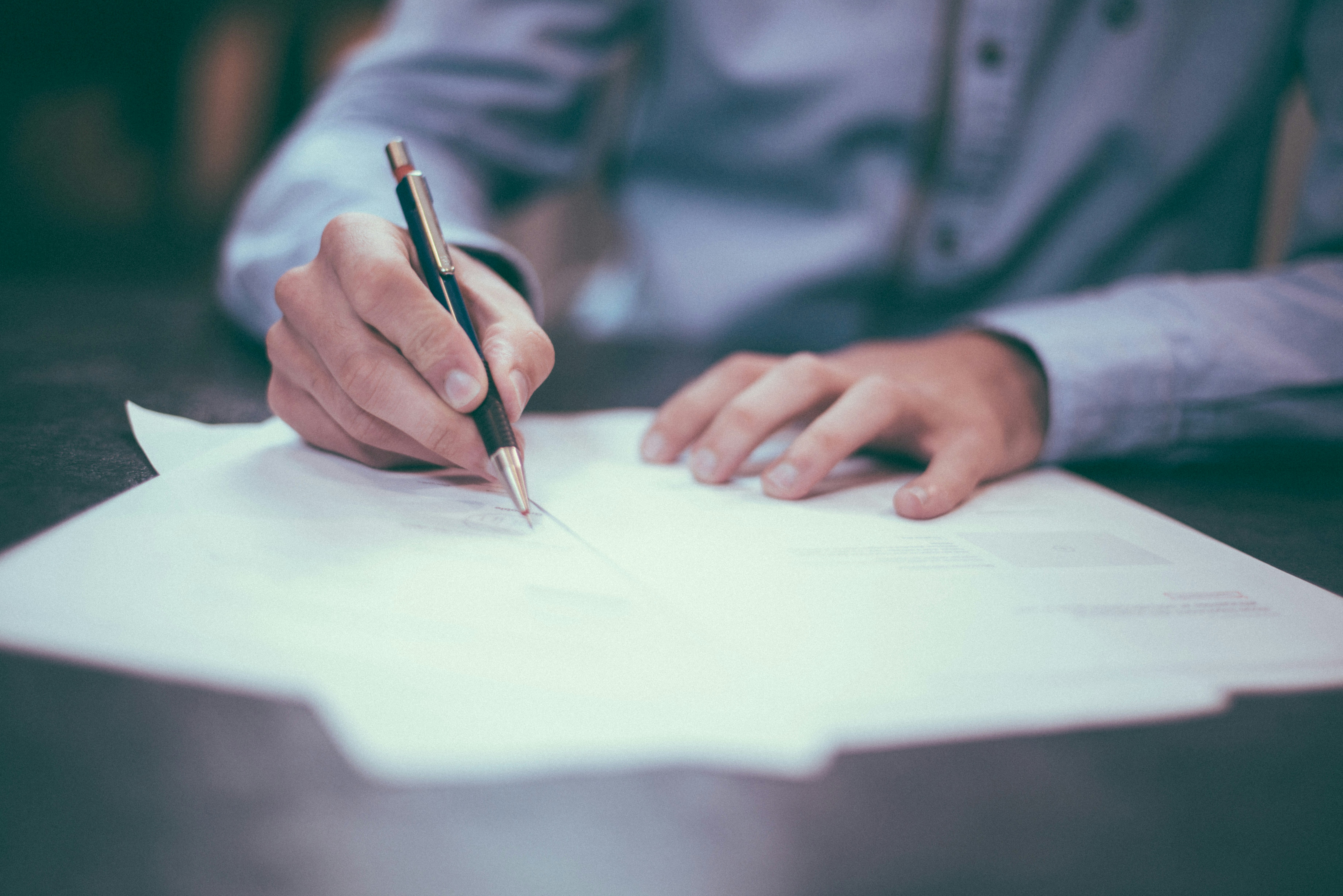Man filling out a form.
